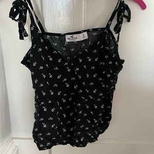 Holister black cropped tank with small white flowers